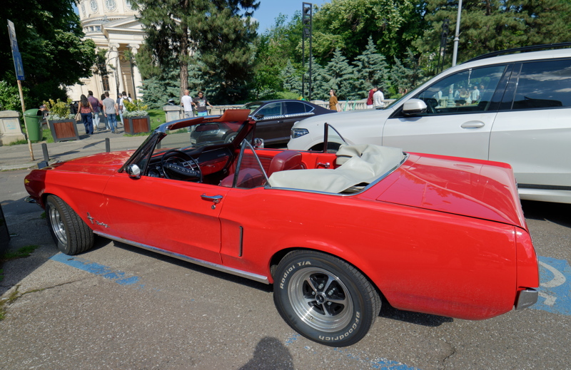 24 - A classic red Ford Mustang convertible parked in the center of Bucharest